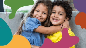 Two smiling children hug on a couch, framed by colorful abstract shapes.