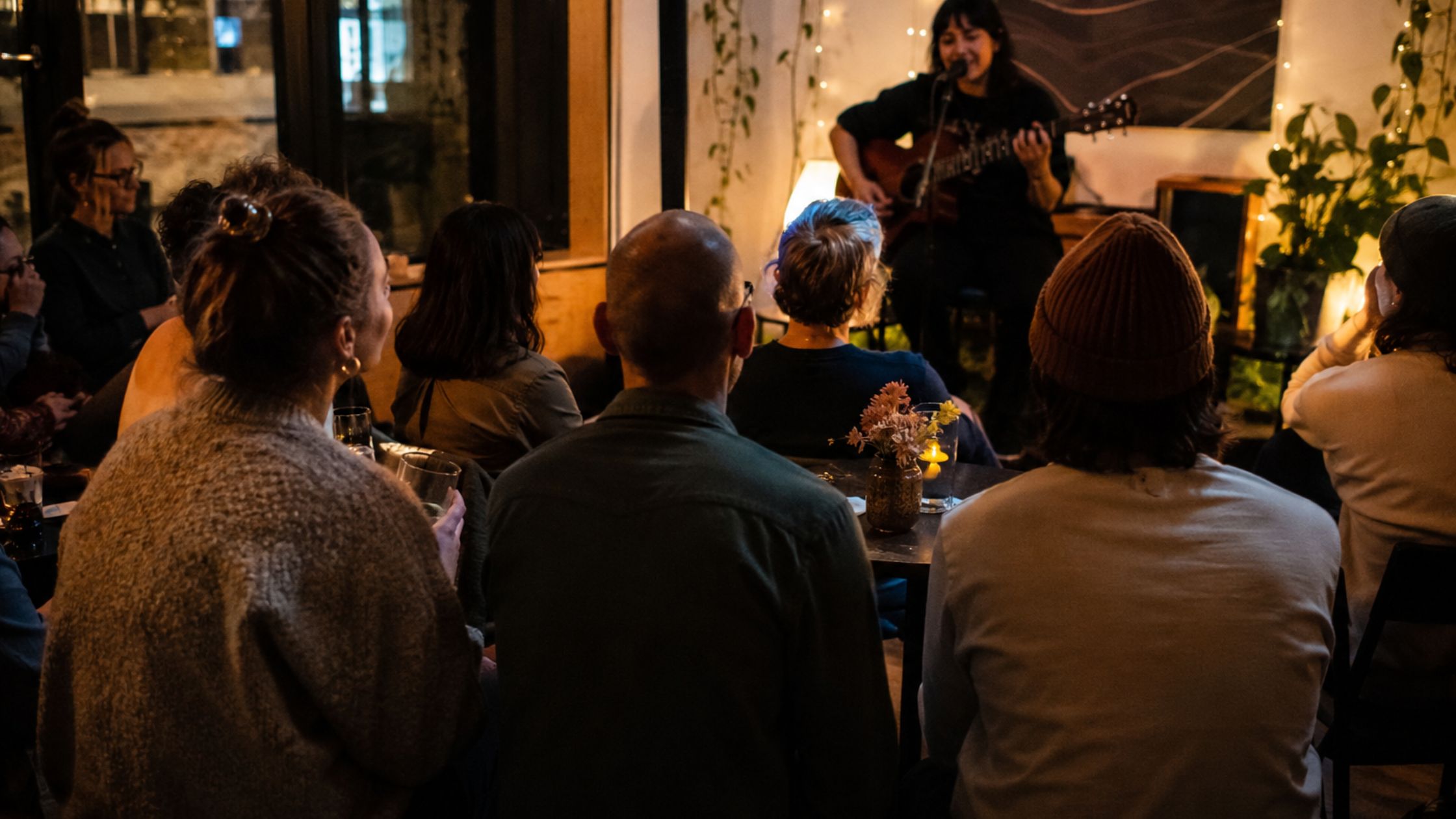 Community supporters gather at a small music-centered nonprofit event.