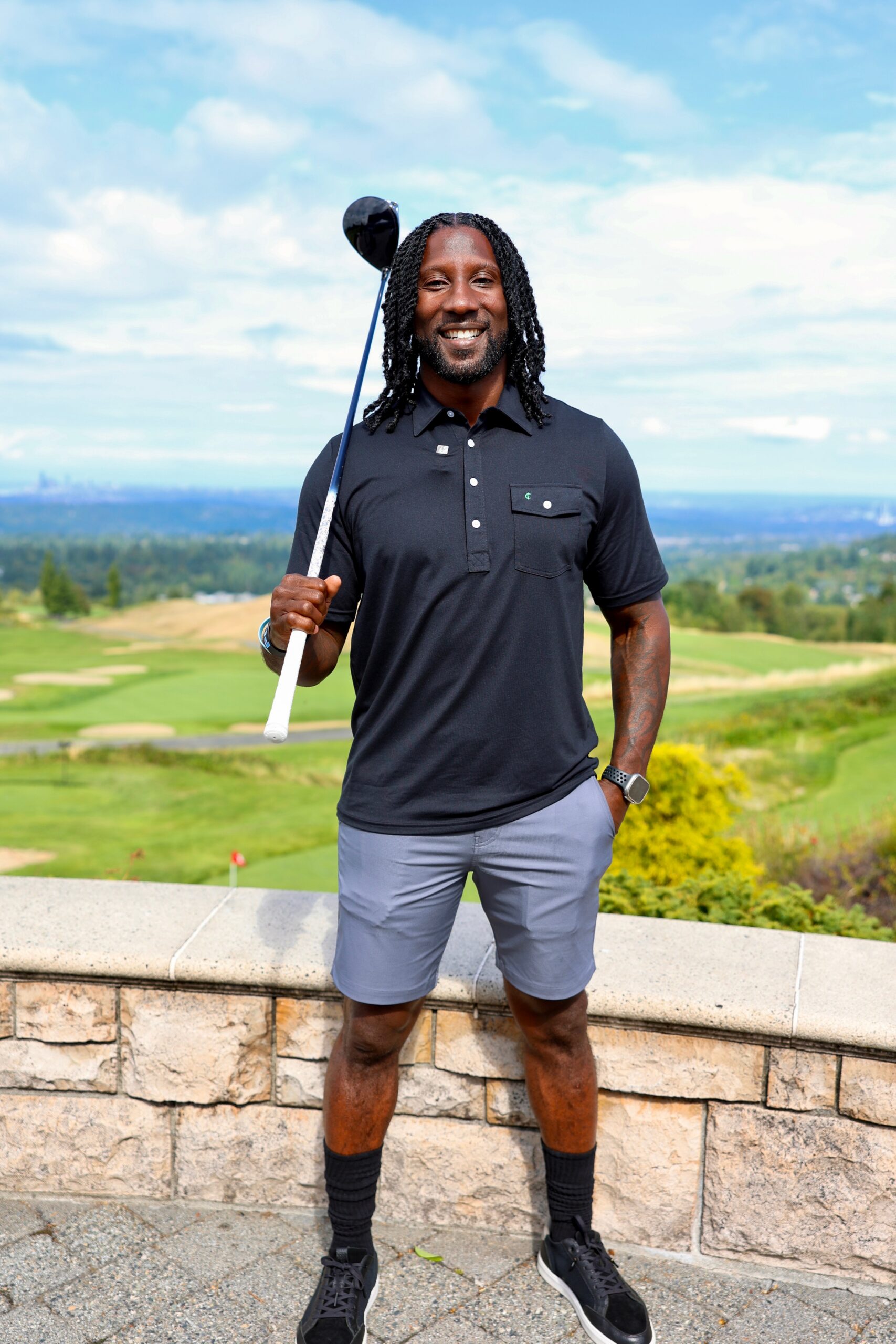 Marcus Trufant smiling on a golf course at a Believe in Me charity golf event