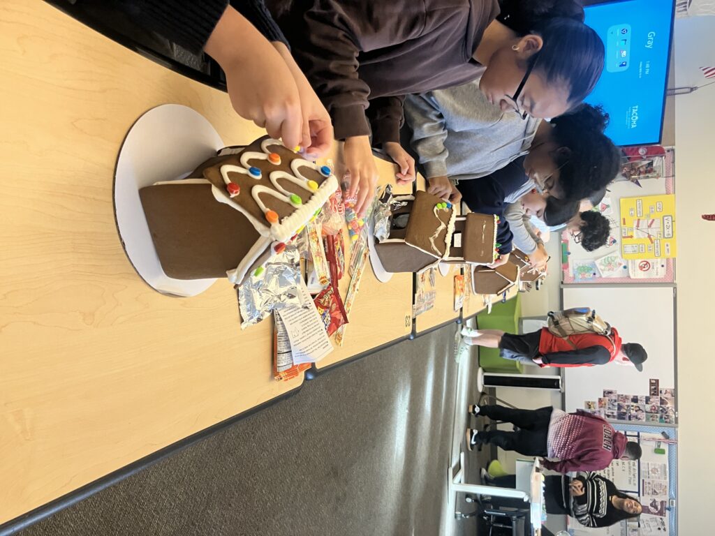 Gingerbread decorating at a community partner holiday activity in Tacoma, 2025.